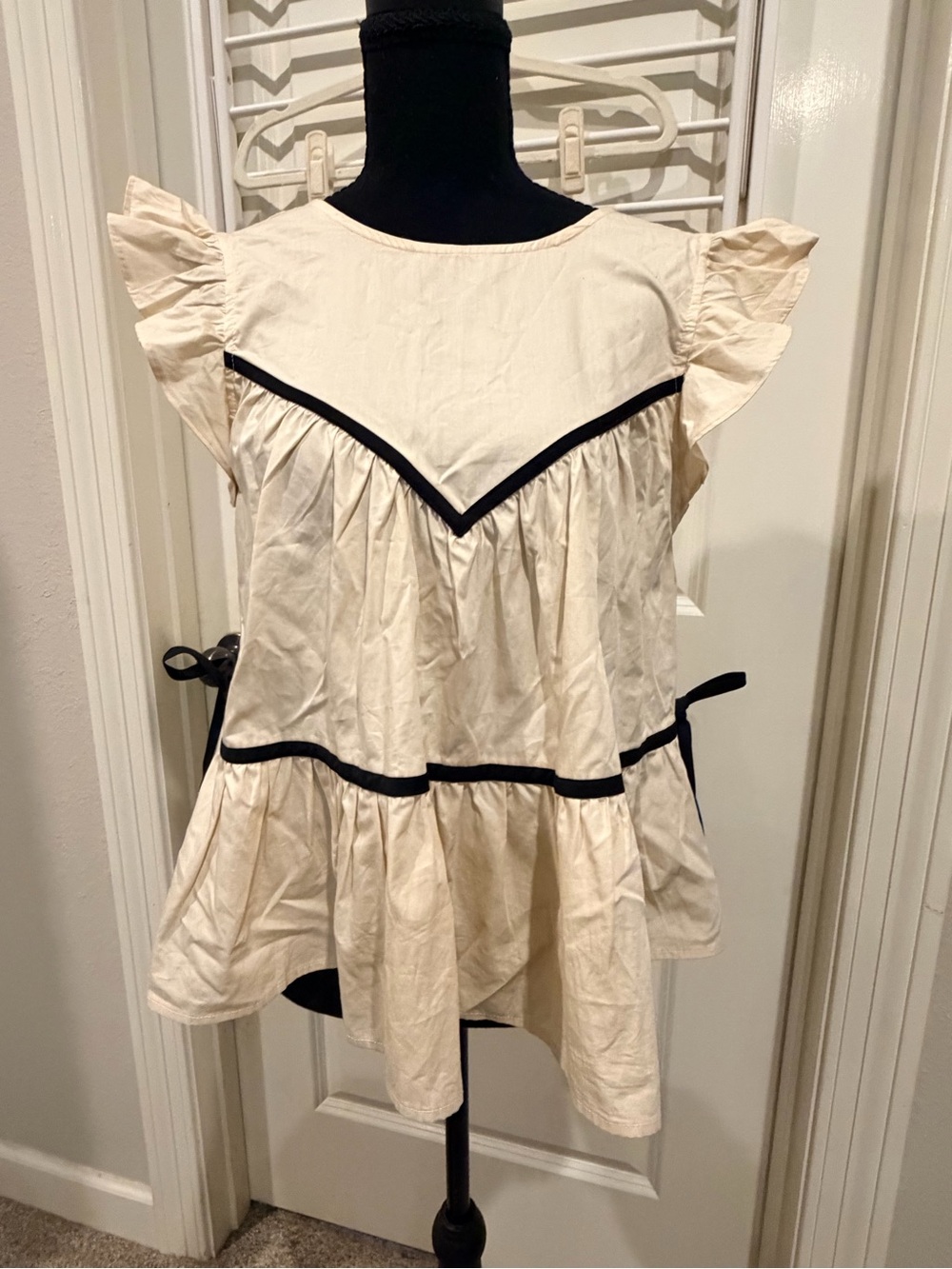 Francesca's Collections Cream Flutter Sleeve Top with Black Trim